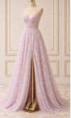 Model wearing a strapless lilac floral lace prom dress with a sheer corset bodice and high leg slit