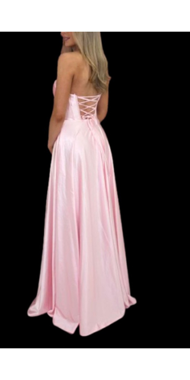 pink satin prom dress with lace up back details