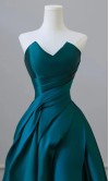 Regal dark teal satin prom dress with a sculpted ruched sweetheart bodice and an elegant drapped A-line skirt