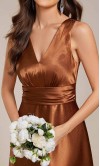 Bronze satin V-neck Fall bridesmaid dress with a flowing floor-length skirt and side pockets