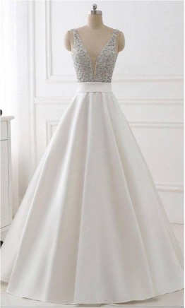 Long white prom dress with sparkling sequin bodice and deep plunging V-neck KSP510